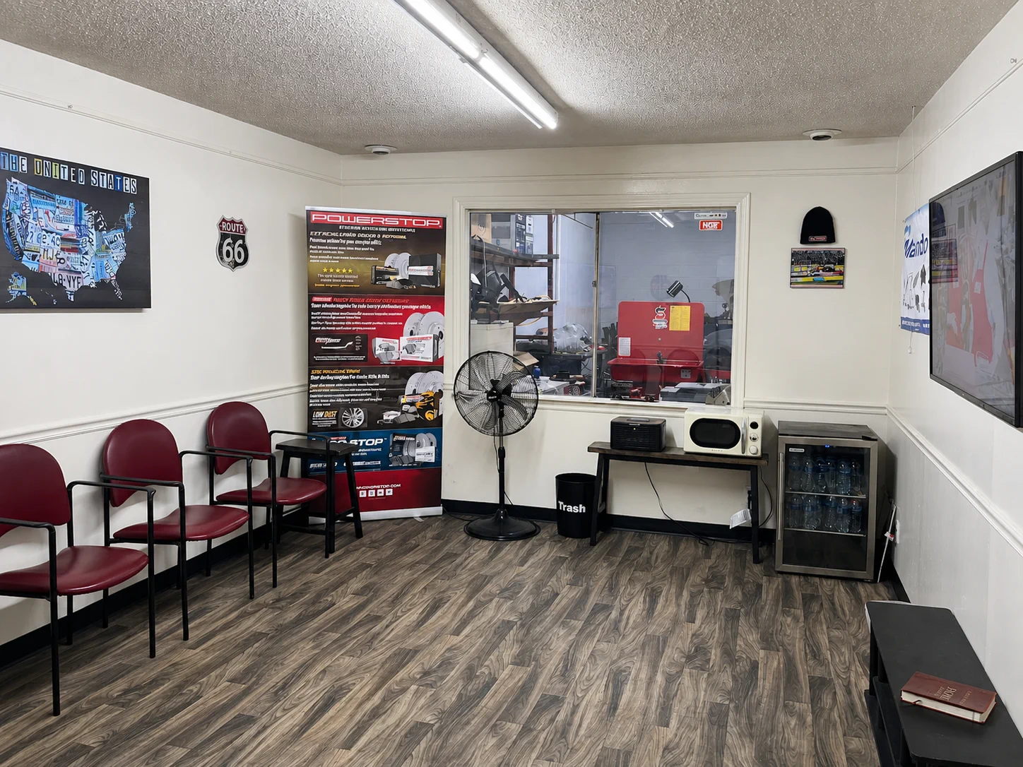 Customer lounge at Mike's Brakes & More with seating, television, and refreshments