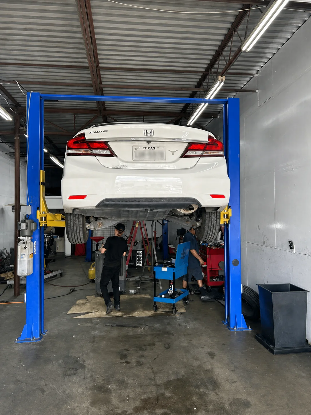 Vehicle raised in an active service bay